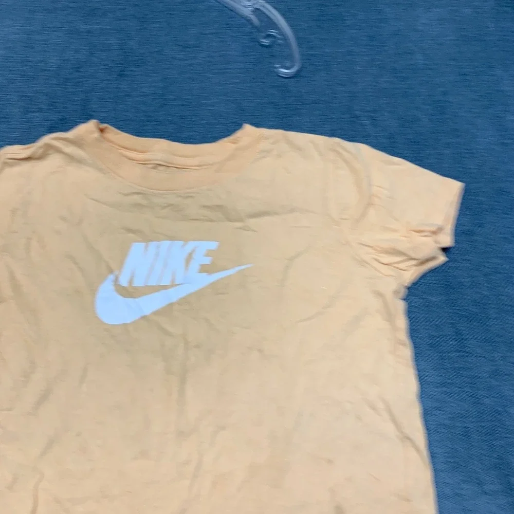 The Nike T Shirt Womens Small Peach Swoosh Logo Crew Neck Short Sleeve Pullover